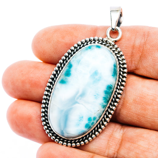 Oval larimar pendant in .925 sterling silver with rope border and top bail