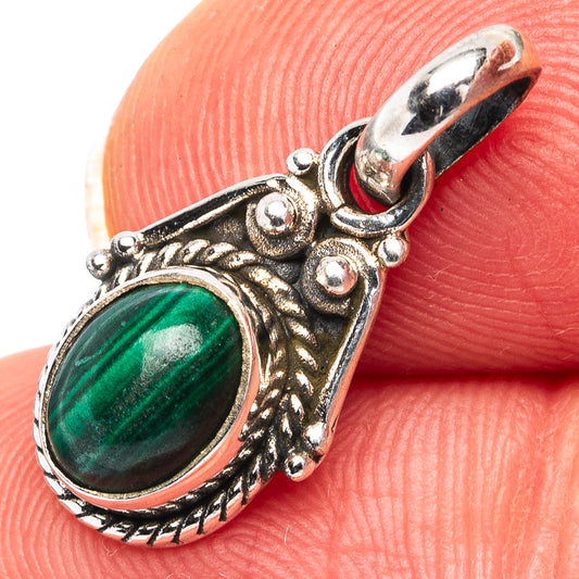 Sterling silver malachite pendant with oval green gemstone and ornate oval bezel