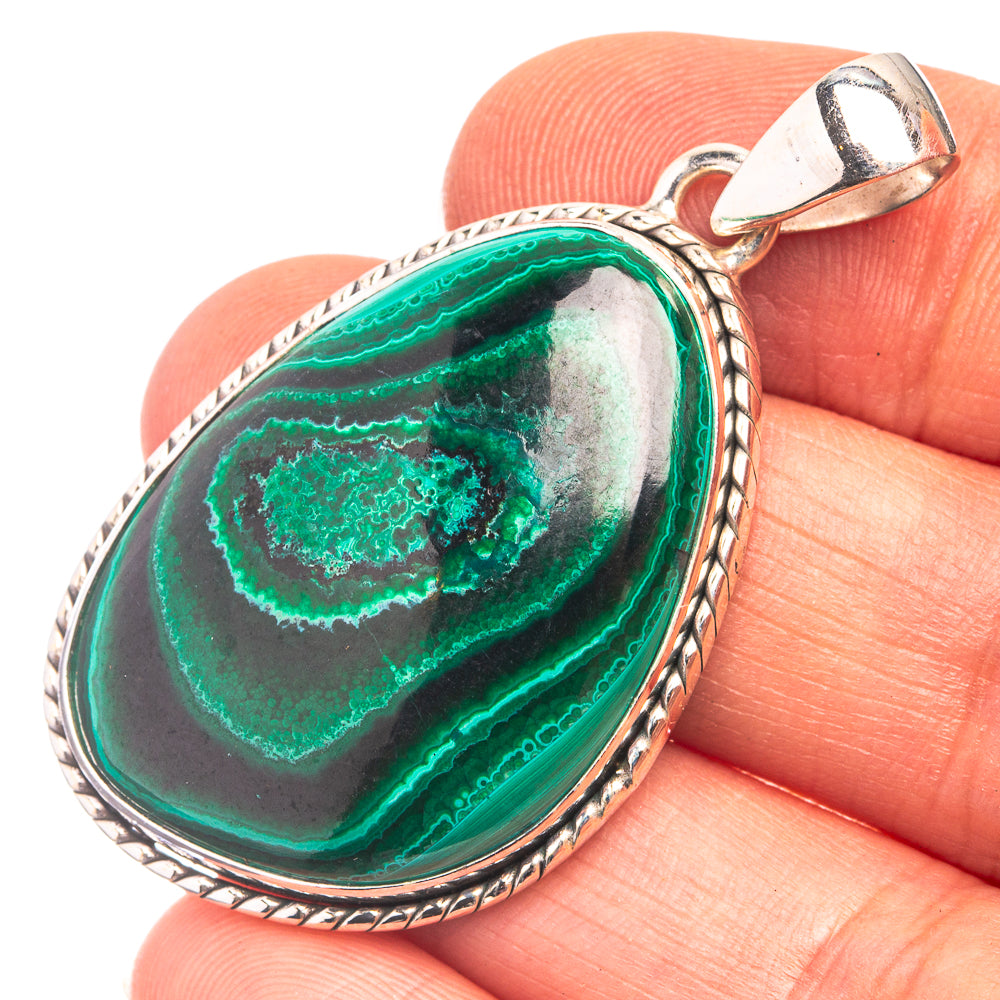 Malachite oval pendant in 925 sterling silver bezel, polished green stone with silver bail.