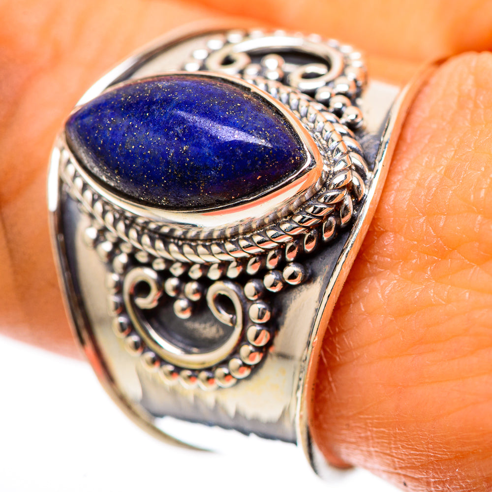Oval lapis lazuli sterling silver ring with ornate filigree setting and blue gemstone