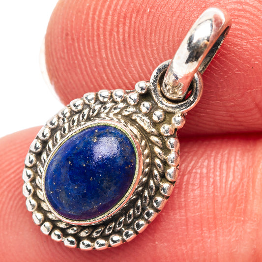 Sterling silver lapis lazuli pendant with round blue stone and ornate bezel