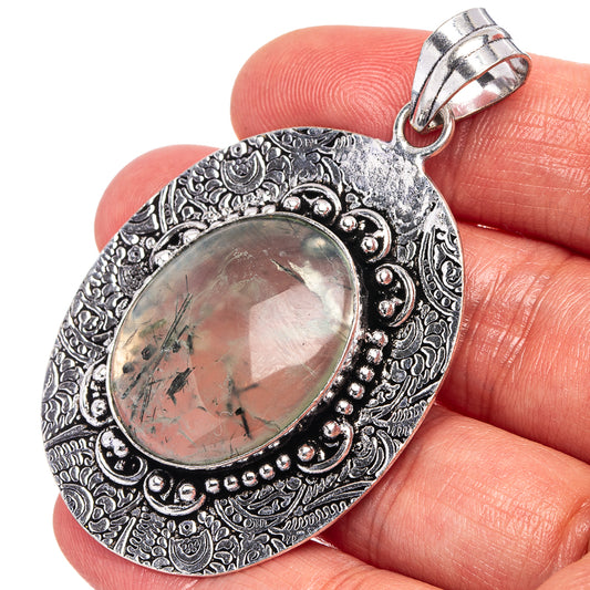 German silver pendant with oval prehnite cabochon and engraved border, bail included