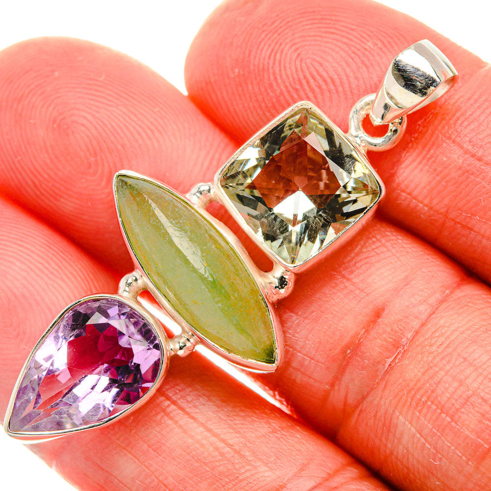 Sterling silver pendant with green leaf-shaped and purple pear faceted gemstones