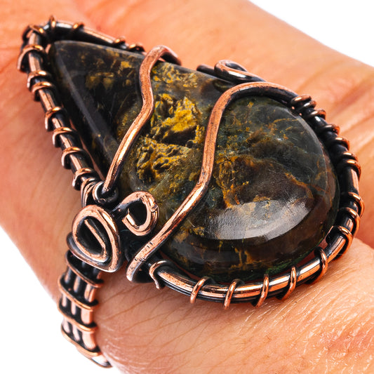 Oxidized copper wire wrap ring with dark gold-speckled teardrop cabochon