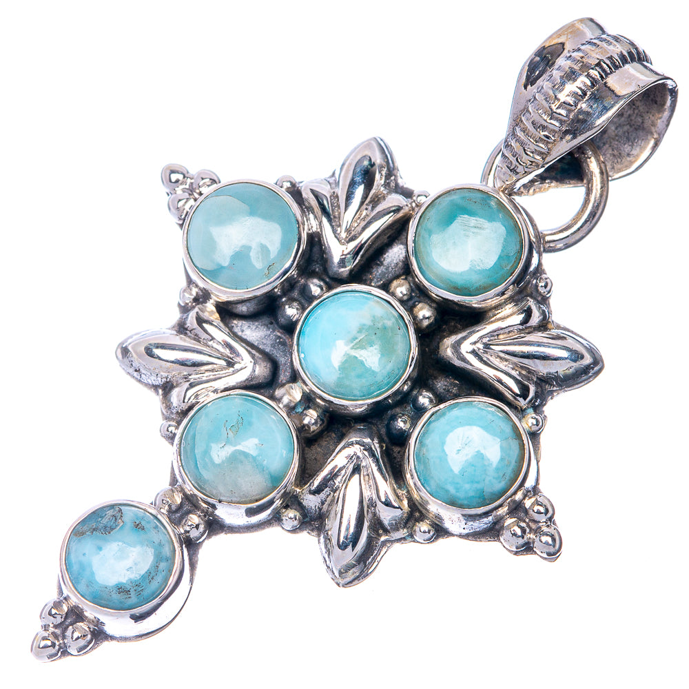 Sterling silver cross pendant with blue-green larimar cabochons, bail at top