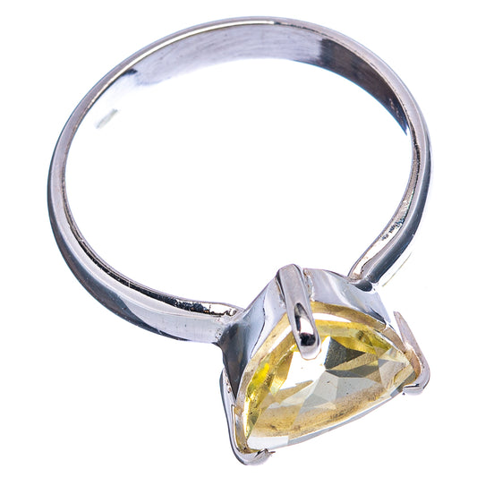 Sterling silver ring with faceted yellow quartz teardrop and prong setting, side view