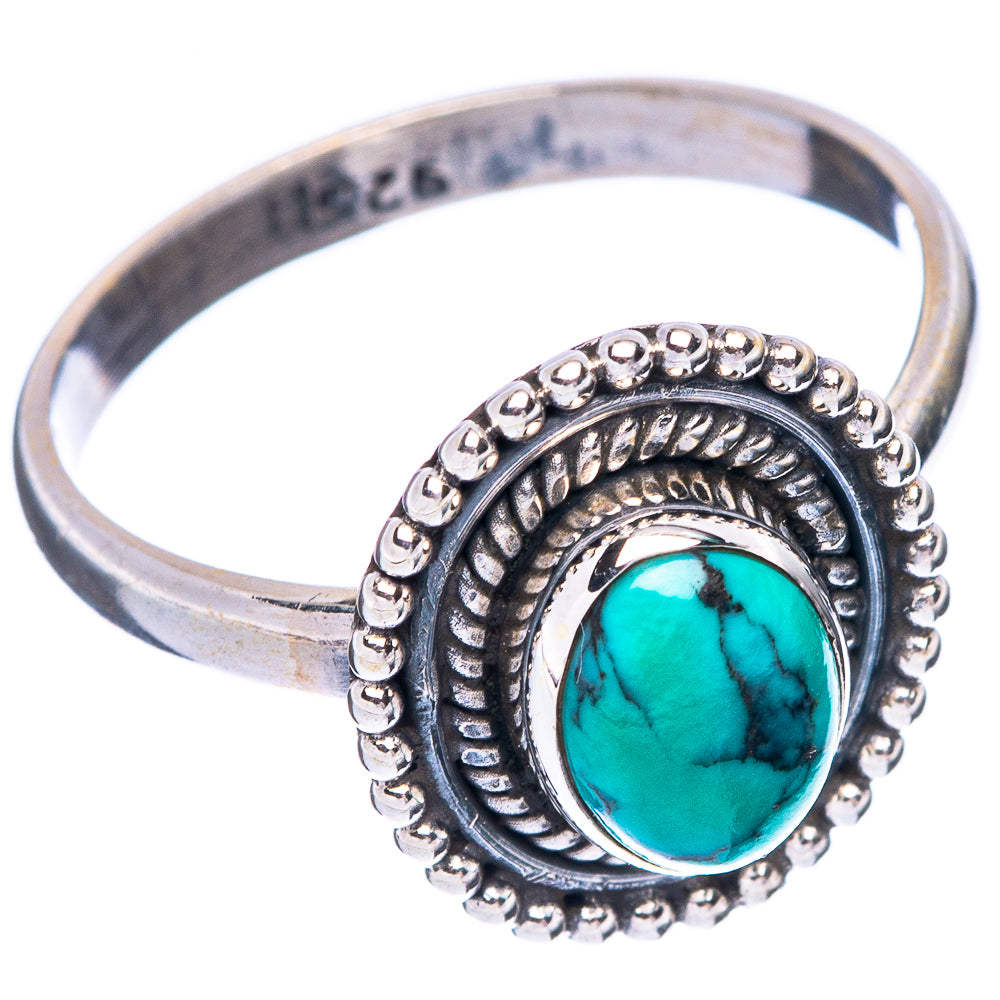 Sterling silver band ring with oval turquoise cabochon and textured beaded frame