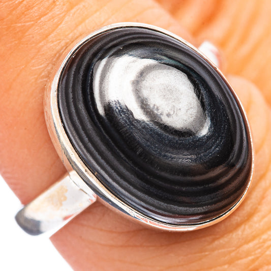 Sterling silver ring with oval black psilomelane cabochon, smooth bezel setting