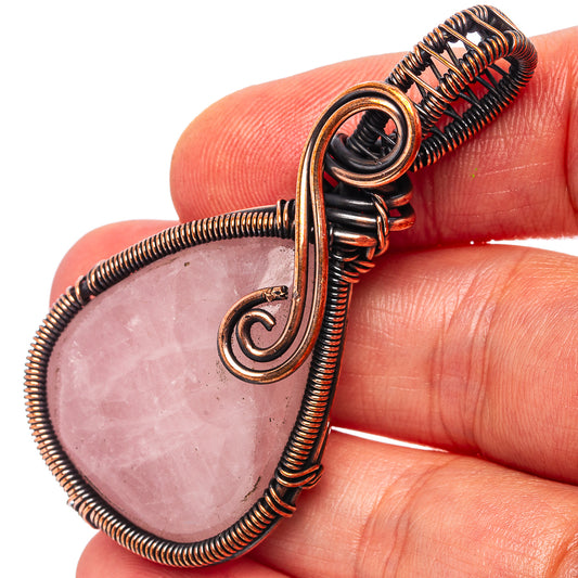 Oxidized copper wire-wrapped rose quartz teardrop pendant with spiral bail