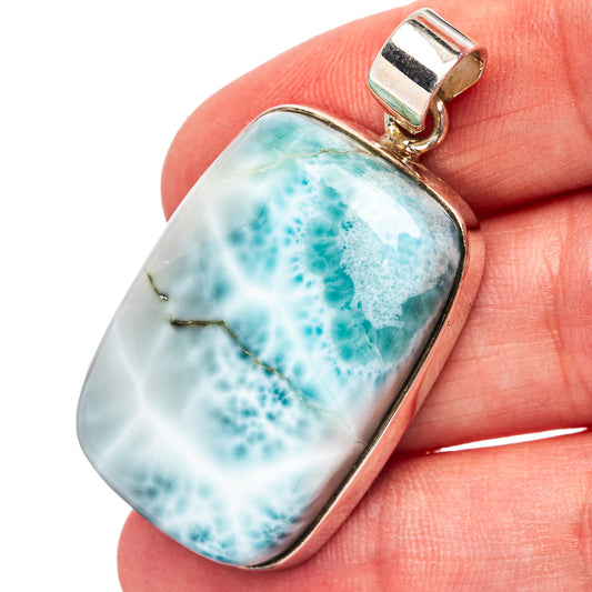 Larimar pendant with .925 sterling silver bezel; blue-green marbled stone, top bail