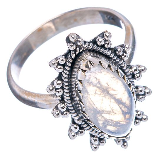 Sterling silver moonstone ring with pear cabochon and raised beadwork cluster around setting