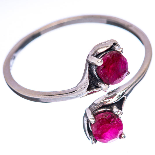 Sterling silver ring with large oval red sillimanite center stone and smaller side stone