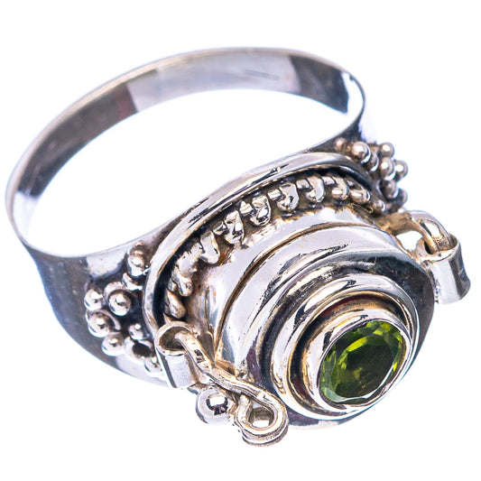 Sterling silver ring with round green gemstone bezel, beaded border and carved details.