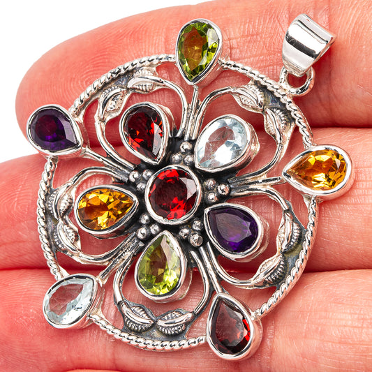 Round sterling silver gemstone pendant with red, yellow, green, purple, and blue stones