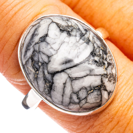 Oval sterling silver ring with white and black pinolith jasper cabochon setting