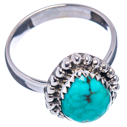 Turquoise cabochon ring in .925 sterling silver, with raised halo of round beads