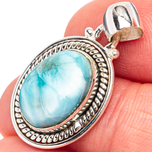 Sterling silver oval larimar pendant with ornate rope border and loop bail