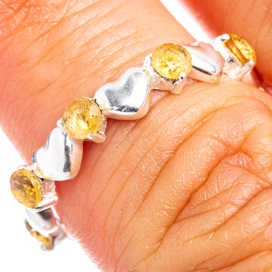 Sterling silver dainty ring with yellow citrine heart bezels on finger, size 6.75
