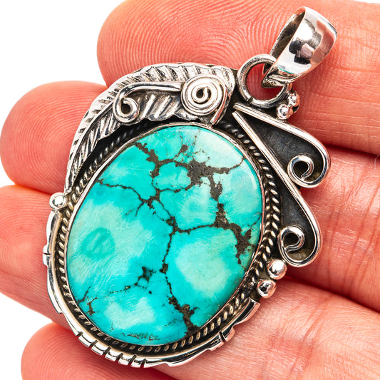 Turquoise cabochon pendant in .925 sterling silver bezel, round gemstone