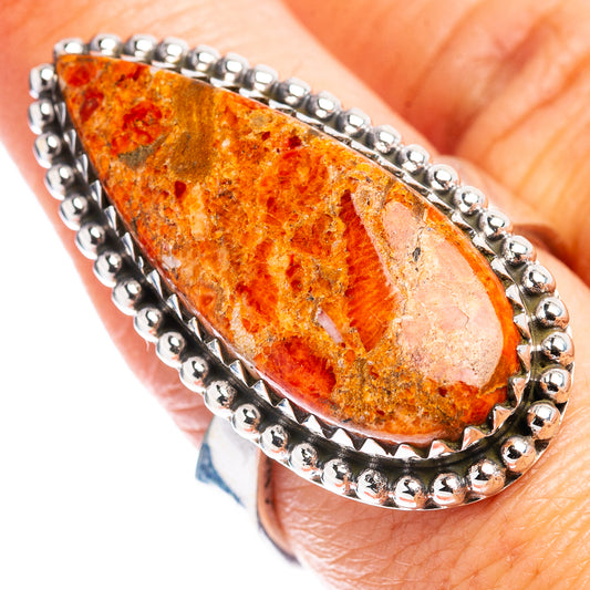 Adjustable size 8 .925 sterling silver ring with teardrop orange coral stone bezel