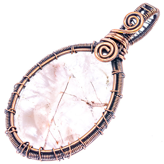 Quartz oval pendant with oxidized copper wire wrap and round spiral bail