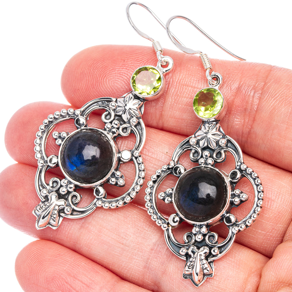 Ornate sterling silver drop earrings with blue labradorite center and green peridot top stones