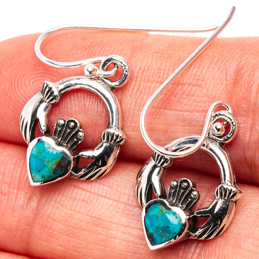 Turquoise heart dangle earrings in .925 sterling silver with hand and heart motifs, oval stone