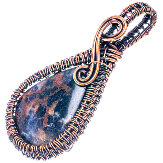 Oxidized copper wire-wrapped sodalite pendant with teardrop blue stone and spiral wire