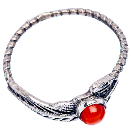 Feather-style sterling silver ring with red oval cabochon and openwork band