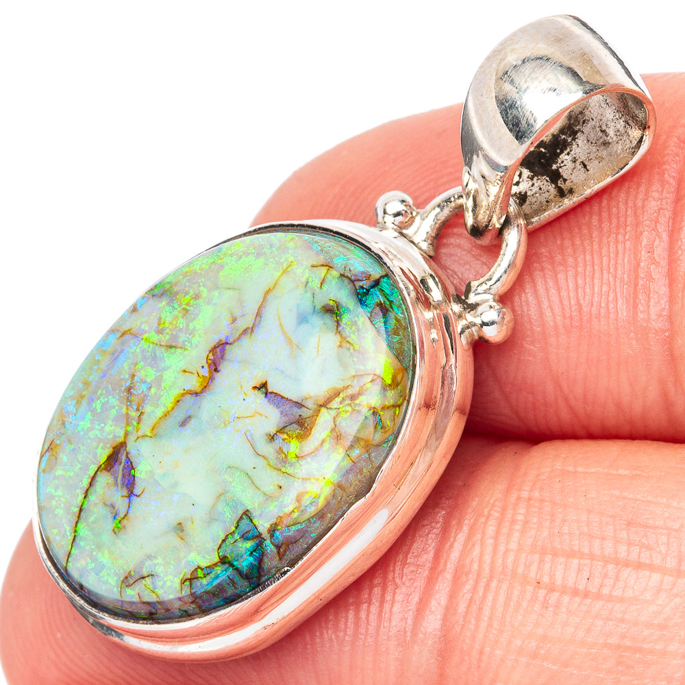 Sterling silver opal pendant with oval iridescent stone and open bail
