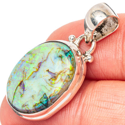 Sterling silver opal pendant with oval iridescent stone and open bail