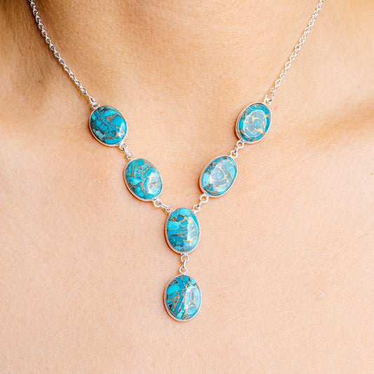 Turquoise stone pendant necklace with oval cabochons and sterling silver chain