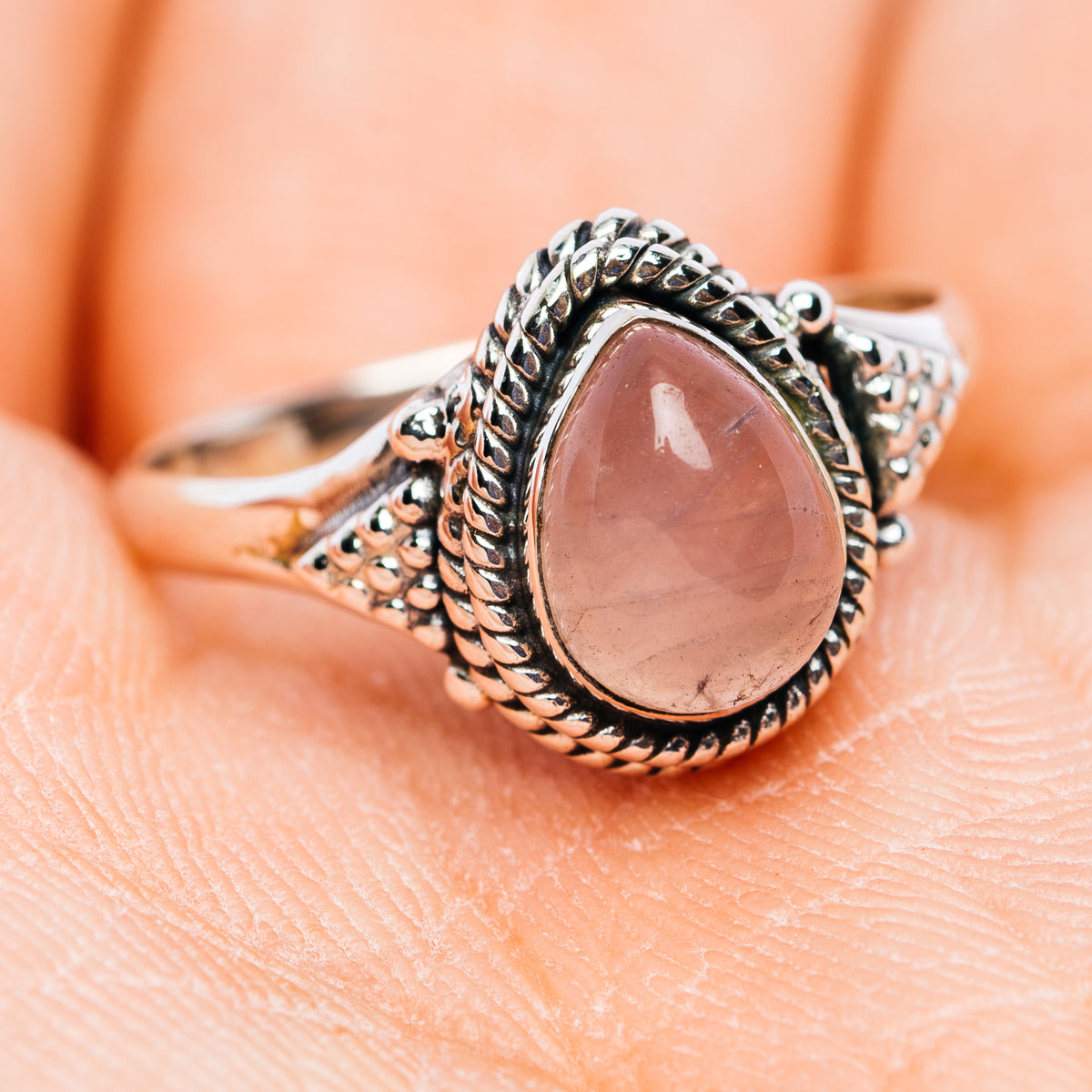 Oval rose quartz 925 sterling silver dainty ring with detailed braided shank
