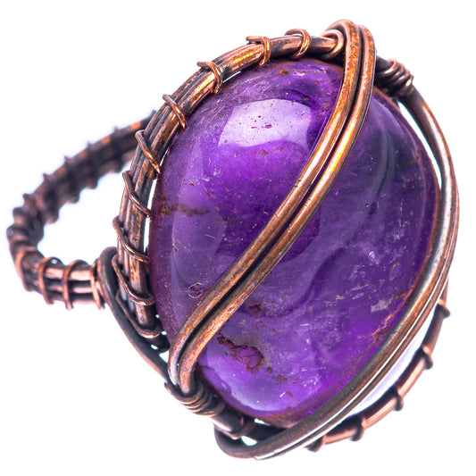 Amethyst oval stone ring with oxidized copper wire frame and crisscross bands