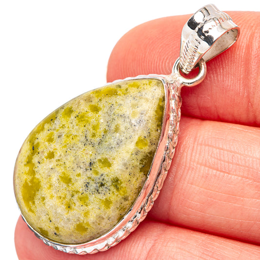 Sterling silver lizardite pendant with oval yellow-green stone in ornate bezel