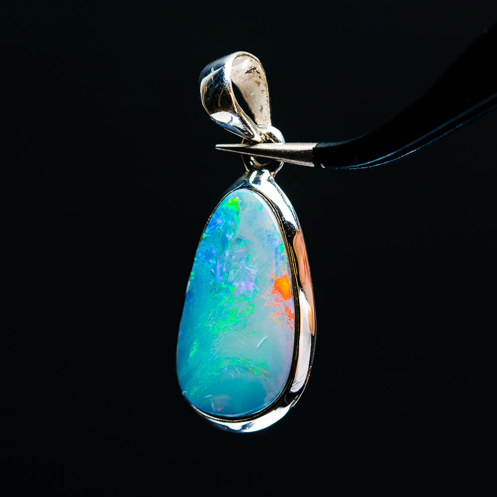 Side view of teardrop opal pendant in .925 sterling silver with blue-green hues
