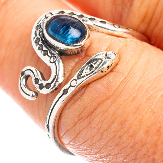Sterling silver snake ring with carved details and oval blue kyanite cabochon on band