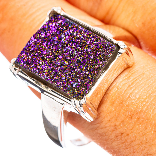 Close-up silver square druzy ring with vivid purple glitter texture and prongs