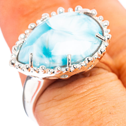Sterling silver Larimar ring with oval blue gemstone and scalloped halo