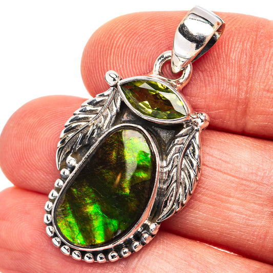 Sterling silver ammolite pendant with oval green gemstone and leaf-pattern frame