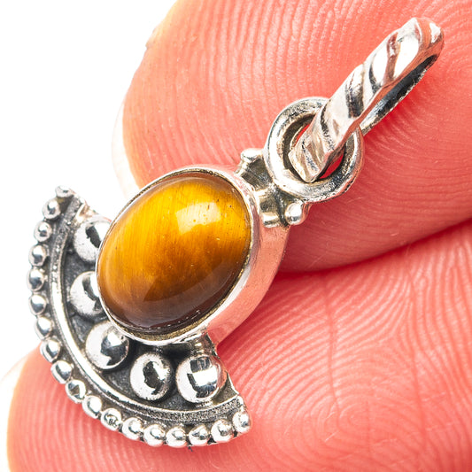 Oval tiger's eye pendant detail in .925 sterling silver with scalloped setting