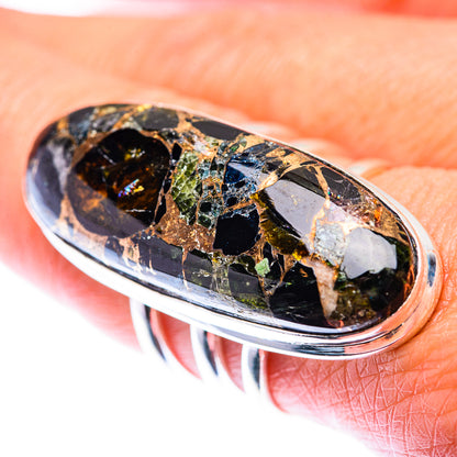 Oval black onyx cocktail ring with colorful mosaic stone accents in silver setting