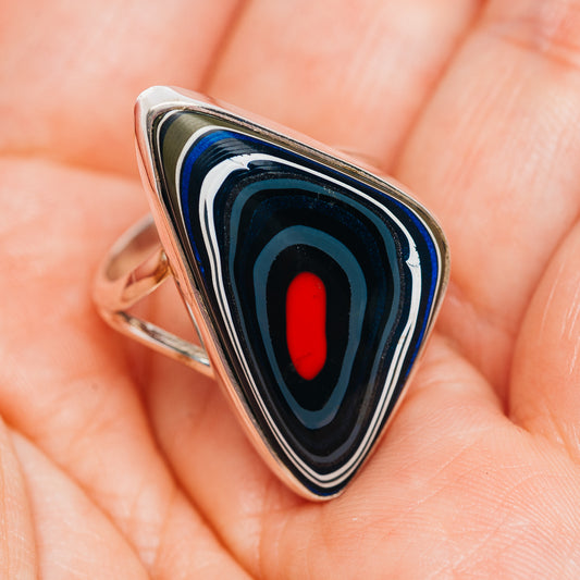 Blue-black triangular inlay ring with red oval center, polished sterling silver band