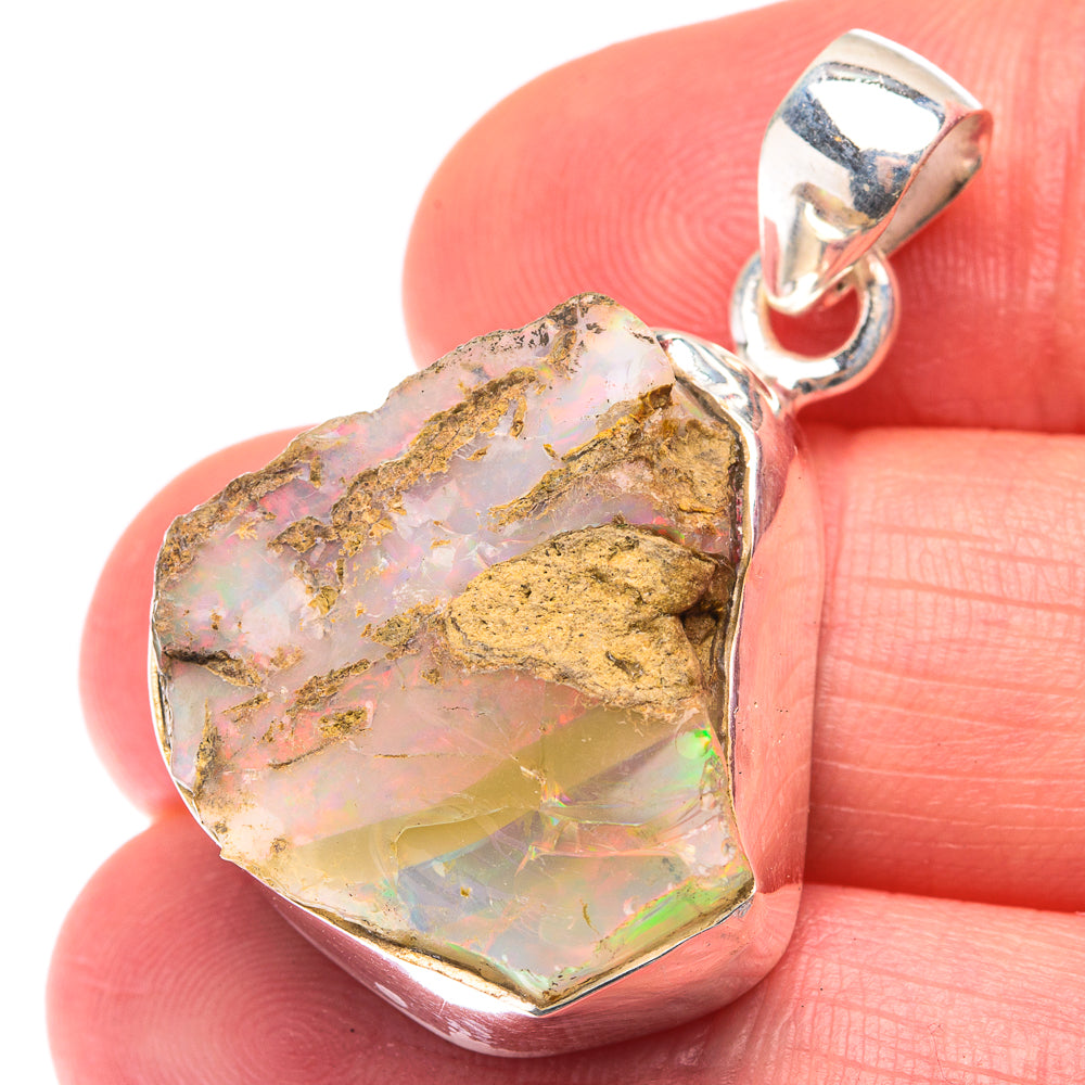Heart-shaped raw opal pendant in 925 sterling silver, iridescent rainbow flashes.