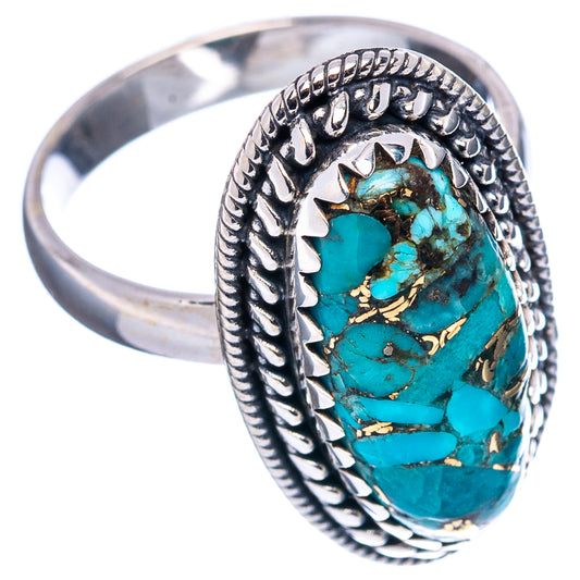 Sterling silver turquoise ring, oval cabochon with detailed bezel and patterned band.