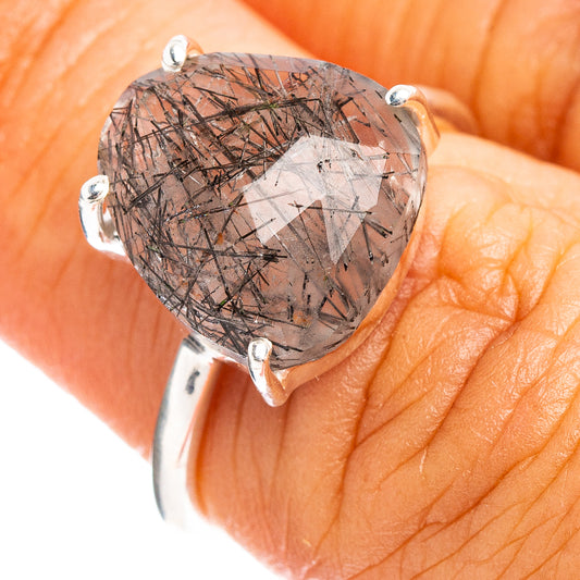 Sterling silver ring with oval faceted dark rutilated quartz center and 4 prongs