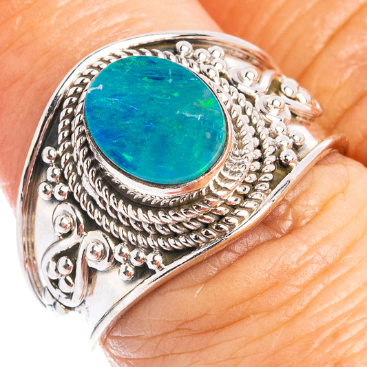 Sterling silver opal ring with ornate filigree and oval teal gemstone
