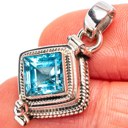 Sterling silver blue topaz square poison pendant with ornate bezel and frame