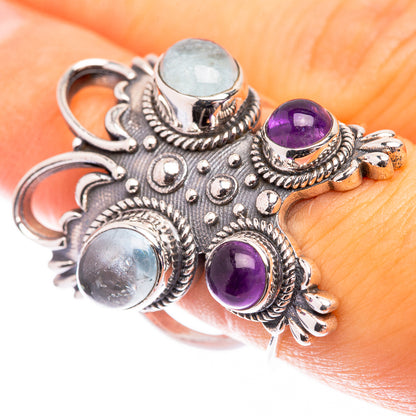 Sterling silver gemstone ring with blue aquamarine and purple amethyst cabochons