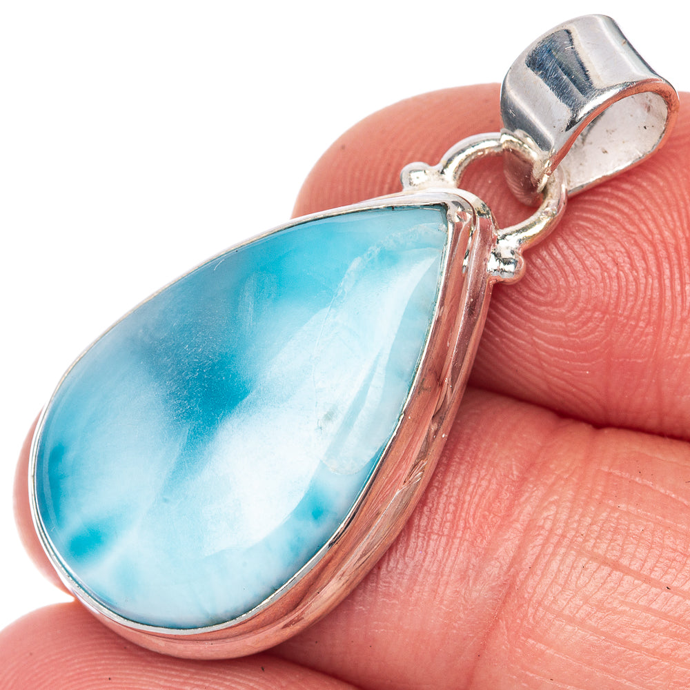 Larimar pendant close-up: teardrop blue stone set in silver bezel